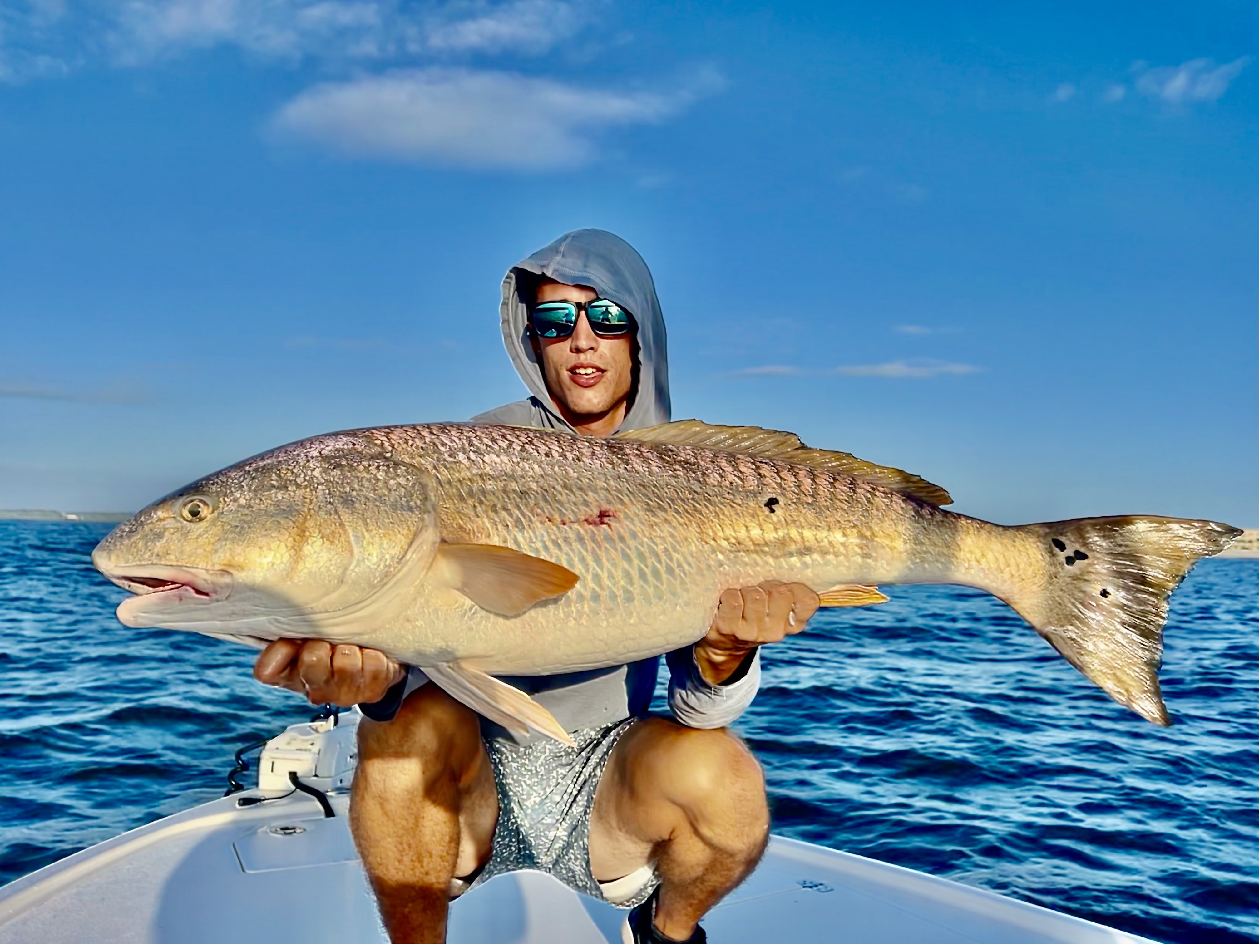 A man holding a Redfish