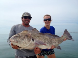 Two people holding a Black Drum