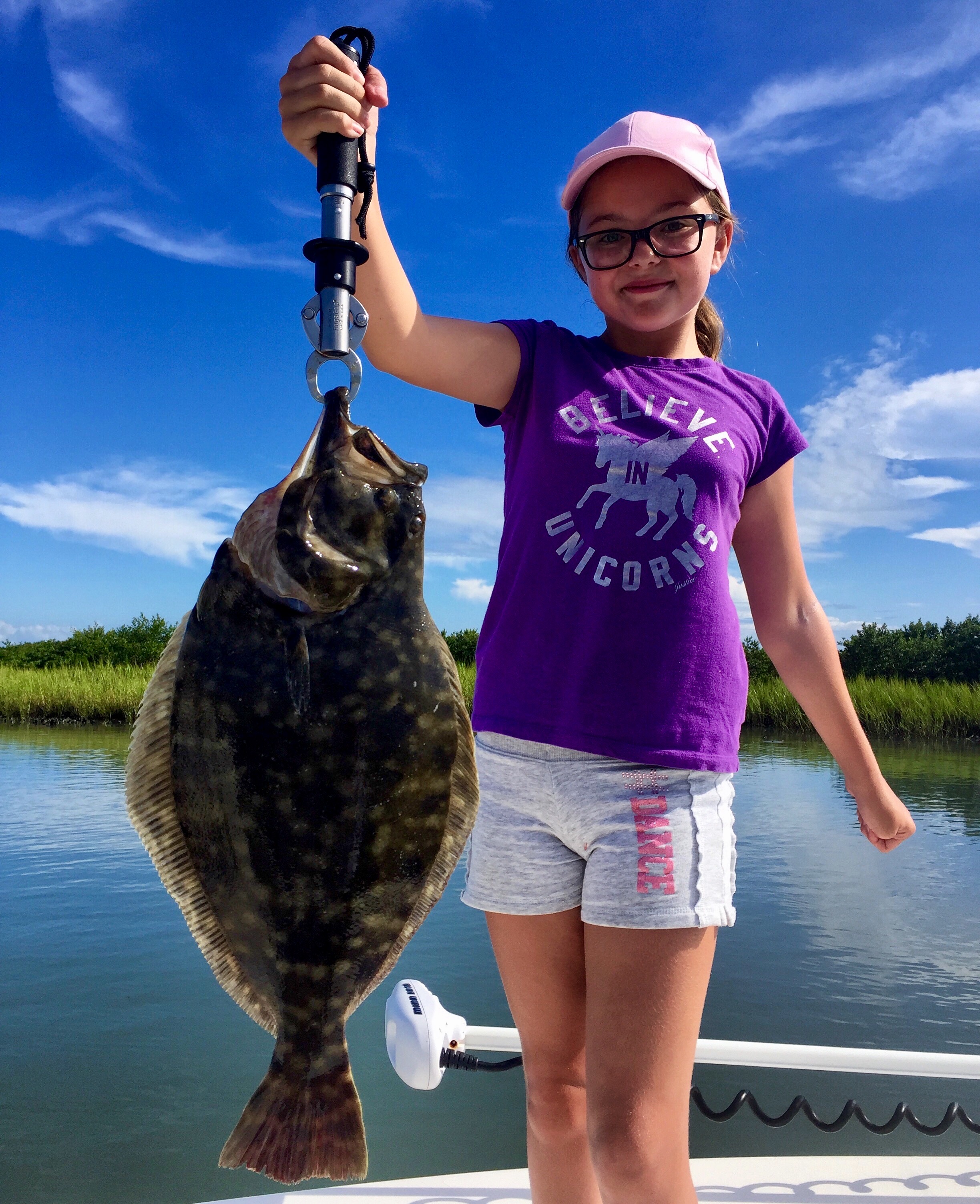 Young Girl Holding Flounder