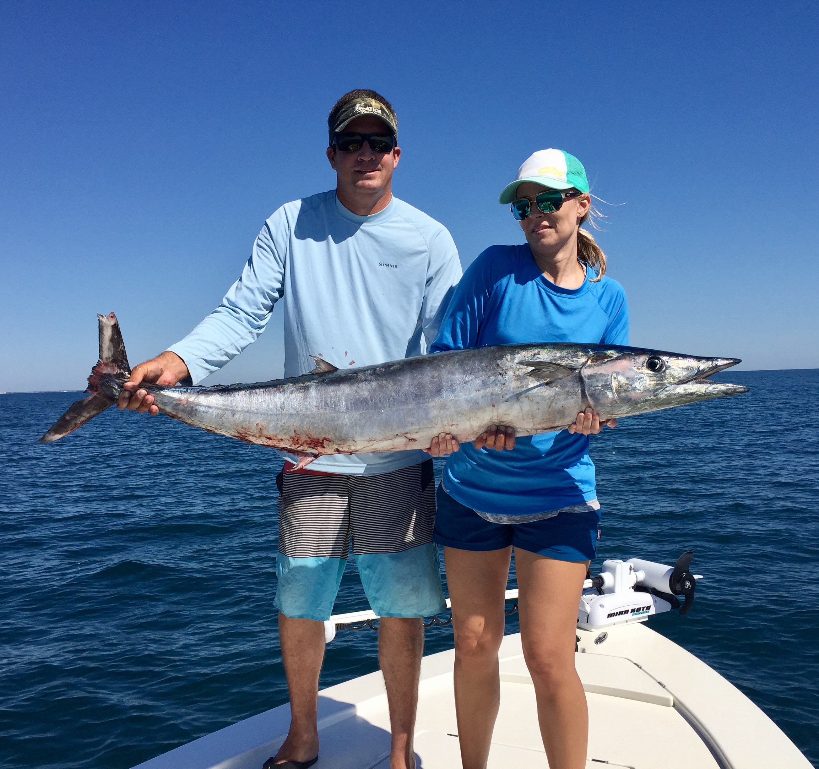 Man and Woman Holding A Wahoo